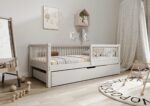 ALFIE Klassisches Kinderbett aus Holz mit runden Sprossen und Bettwäsche-Schublade